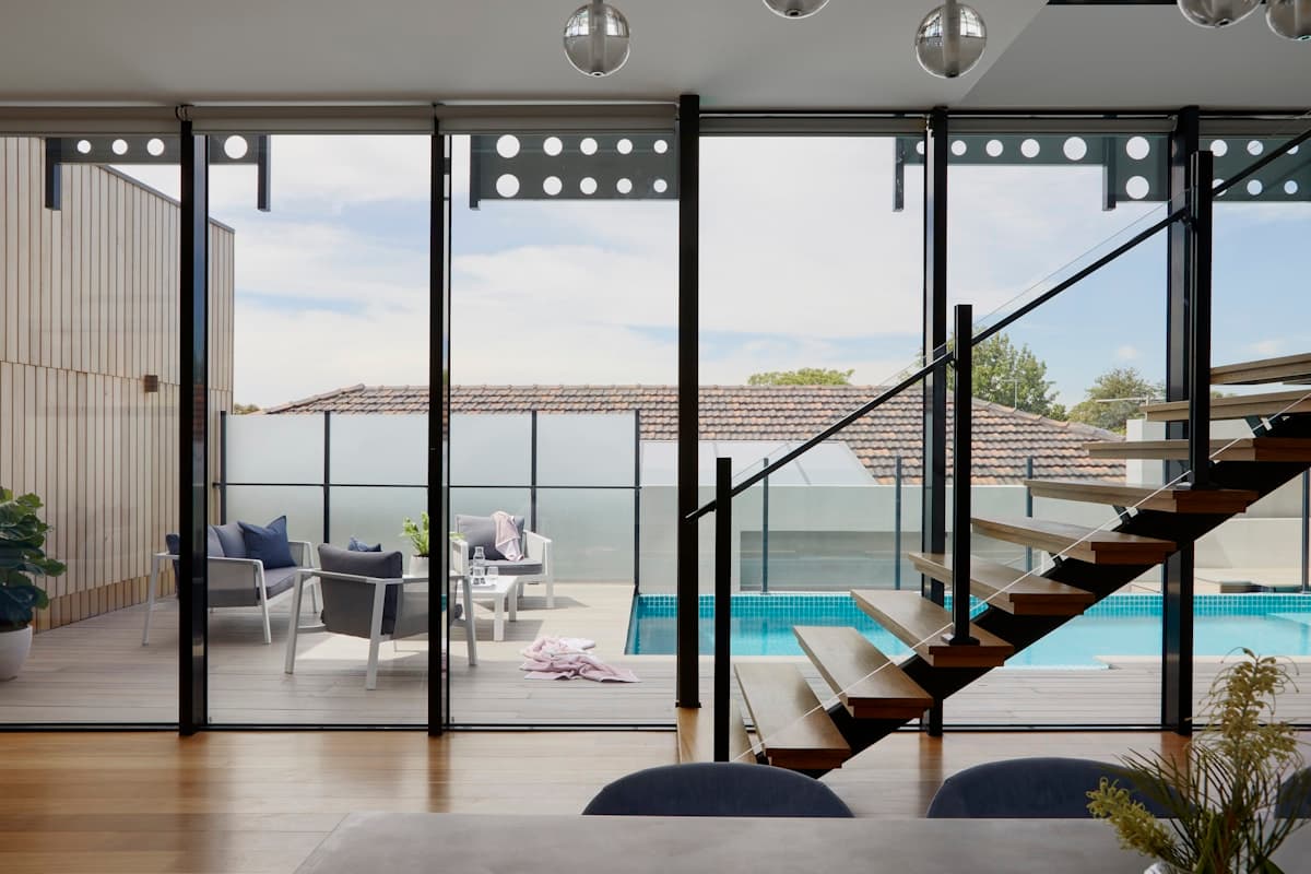 Sunlit modern residence with quiet, refined interiors